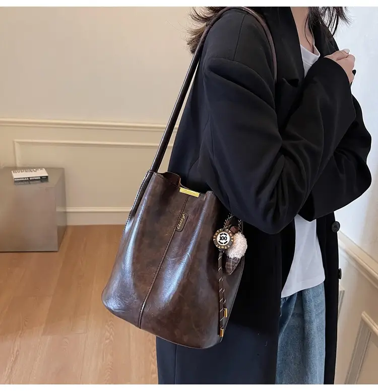 Vintage Brown Leather Bucket Bag with Chain Strap — feature 9