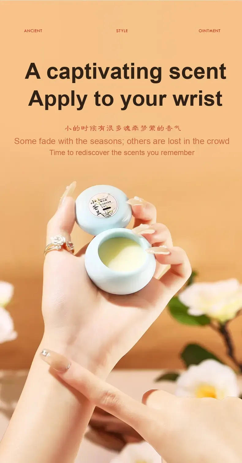 Hand holding an open pale blue perfume balm pot and its lid.