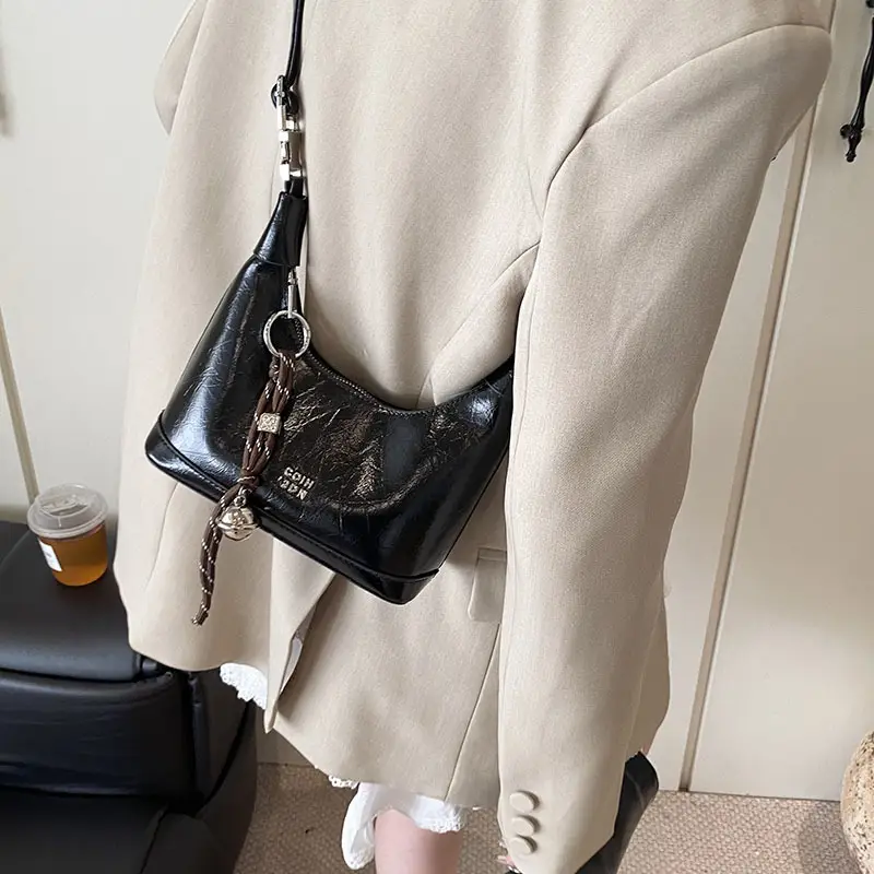 Black Leather Pea Bag with Gold Handle for Women - Image 9