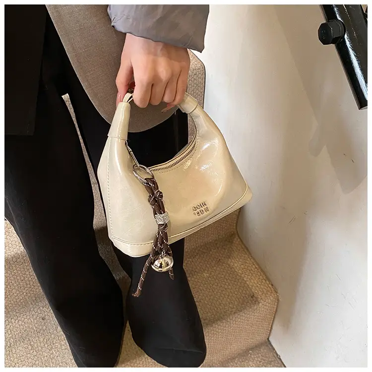 Black Leather Pea Bag with Gold Handle for Women — feature 16