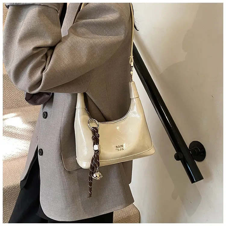 Black Leather Pea Bag with Gold Handle for Women — feature 17