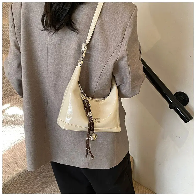 Black Leather Pea Bag with Gold Handle for Women — feature 19
