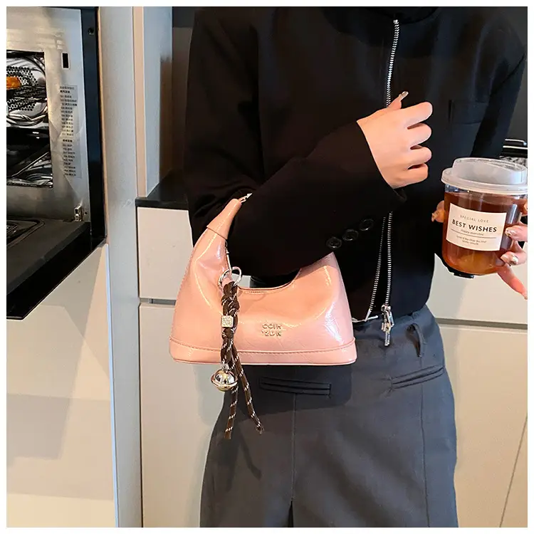 Black Leather Pea Bag with Gold Handle for Women — feature 21