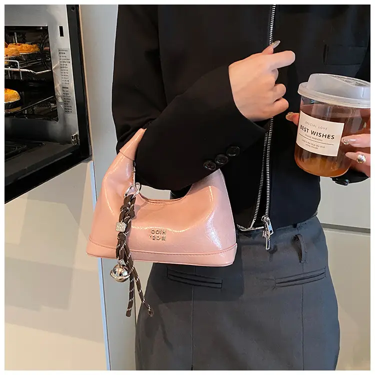 Black Leather Pea Bag with Gold Handle for Women — feature 22