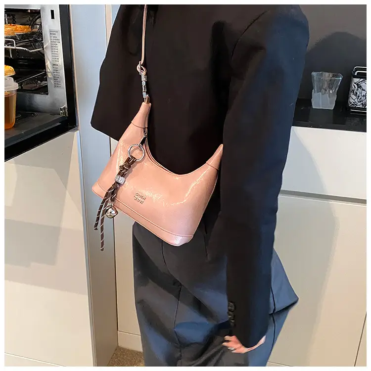 Black Leather Pea Bag with Gold Handle for Women — feature 25