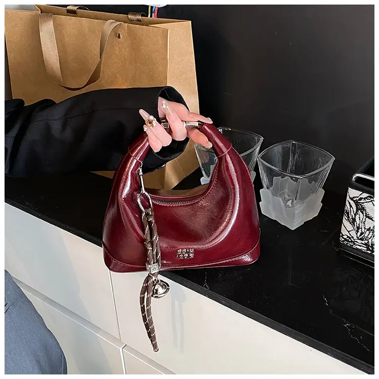 Black Leather Pea Bag with Gold Handle for Women — feature 26