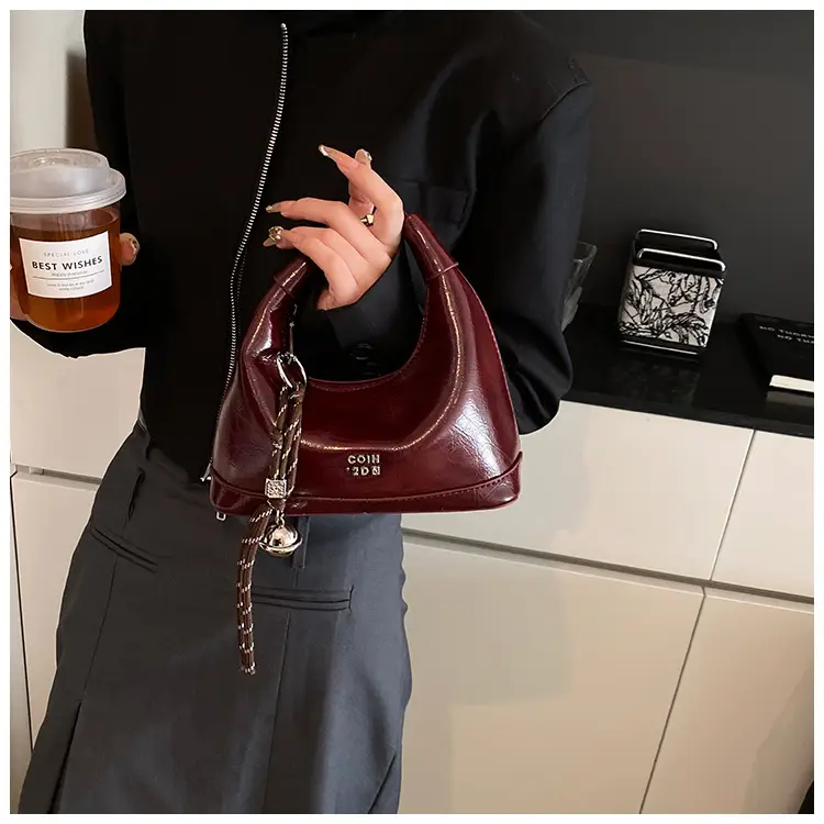 Black Leather Pea Bag with Gold Handle for Women — feature 27