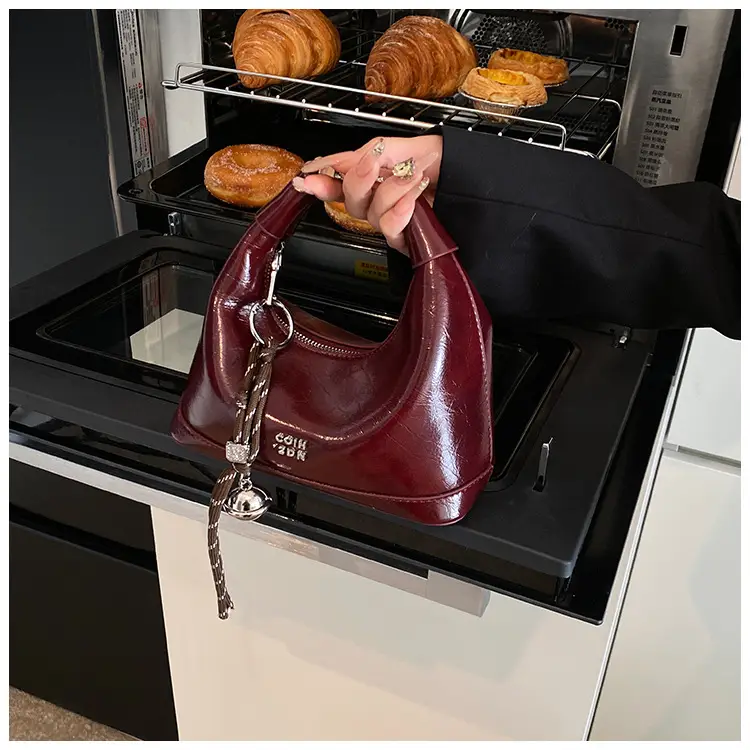 Black Leather Pea Bag with Gold Handle for Women — feature 29