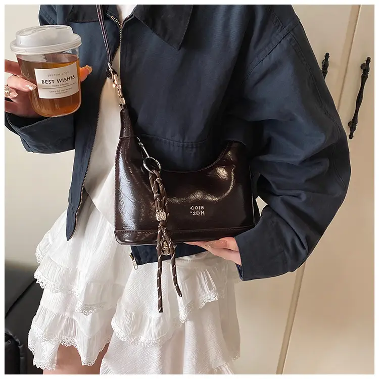 Black Leather Pea Bag with Gold Handle for Women — feature 31