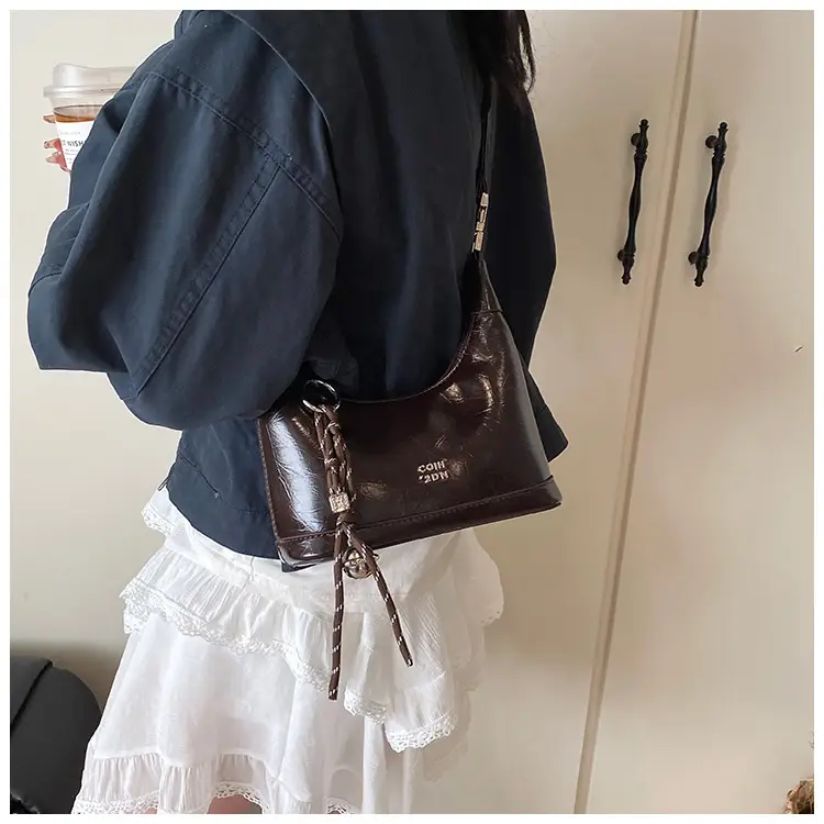 Black Leather Pea Bag with Gold Handle for Women — feature 32