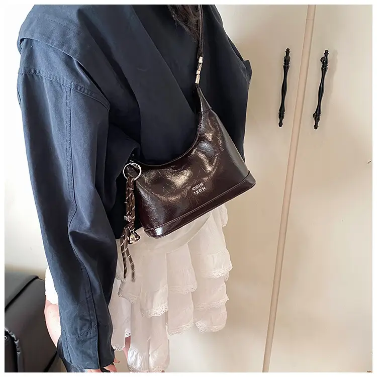 Black Leather Pea Bag with Gold Handle for Women — feature 33