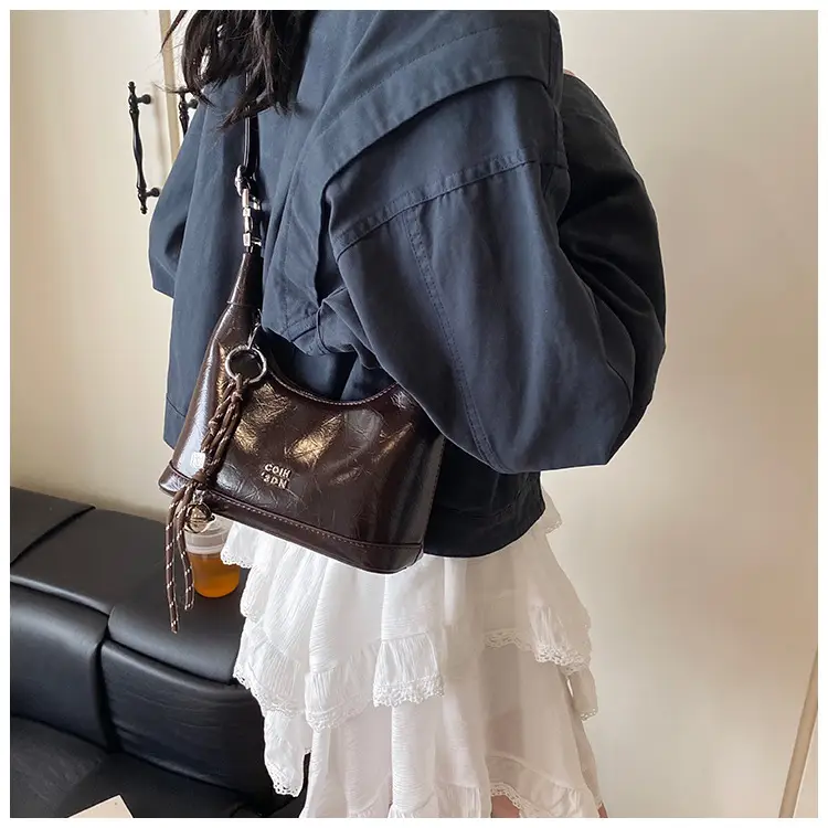 Black Leather Pea Bag with Gold Handle for Women — feature 35