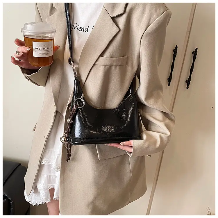 Black Leather Pea Bag with Gold Handle for Women — feature 36