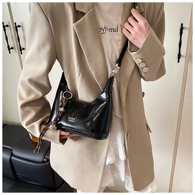Black Leather Pea Bag with Gold Handle for Women — feature 37