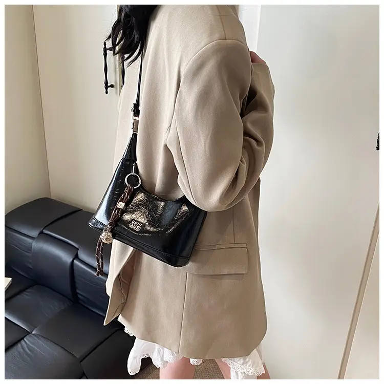 Black Leather Pea Bag with Gold Handle for Women — feature 38