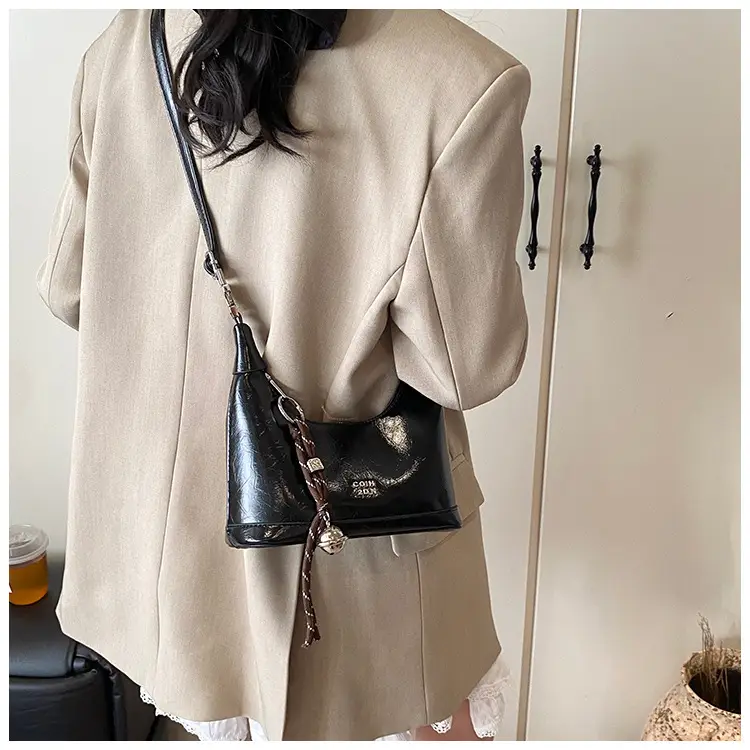 Black Leather Pea Bag with Gold Handle for Women — feature 39