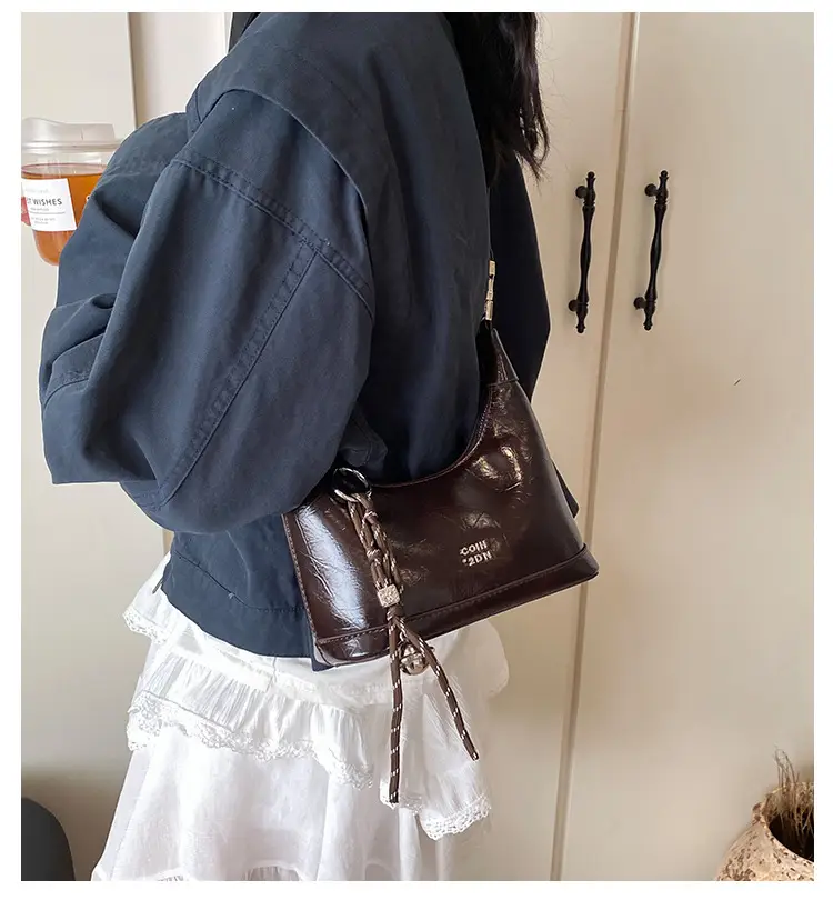Black Leather Pea Bag with Gold Handle for Women — feature 4
