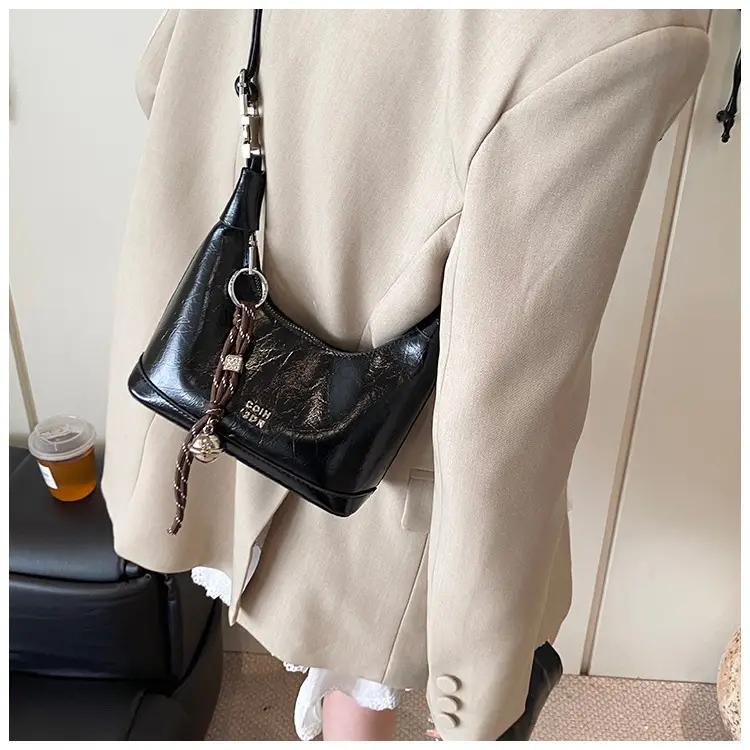 Black Leather Pea Bag with Gold Handle for Women — feature 40
