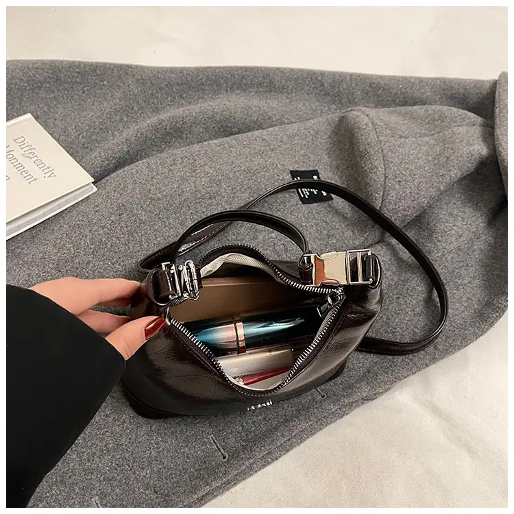 Black Leather Pea Bag with Gold Handle for Women — feature 42