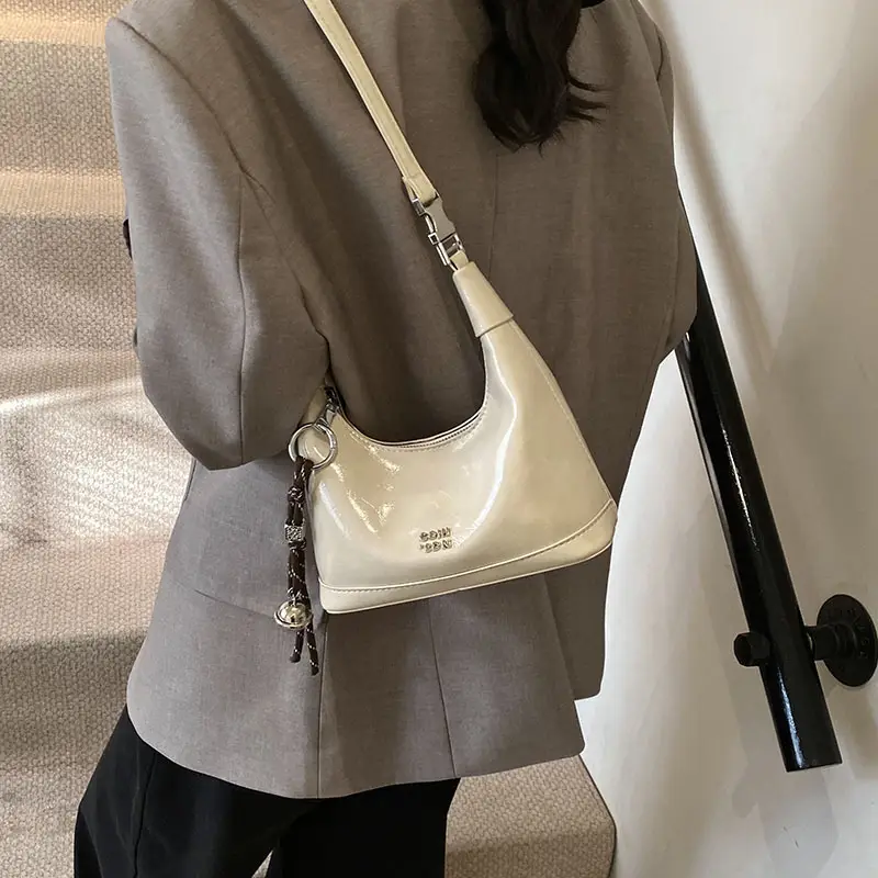 Black Leather Pea Bag with Gold Handle for Women - Image 2