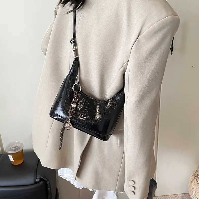 Black Leather Pea Bag with Gold Handle for Women - Image 3