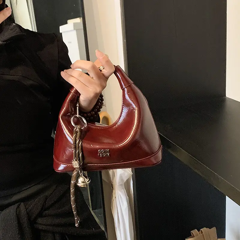 Black Leather Pea Bag with Gold Handle for Women - Image 4