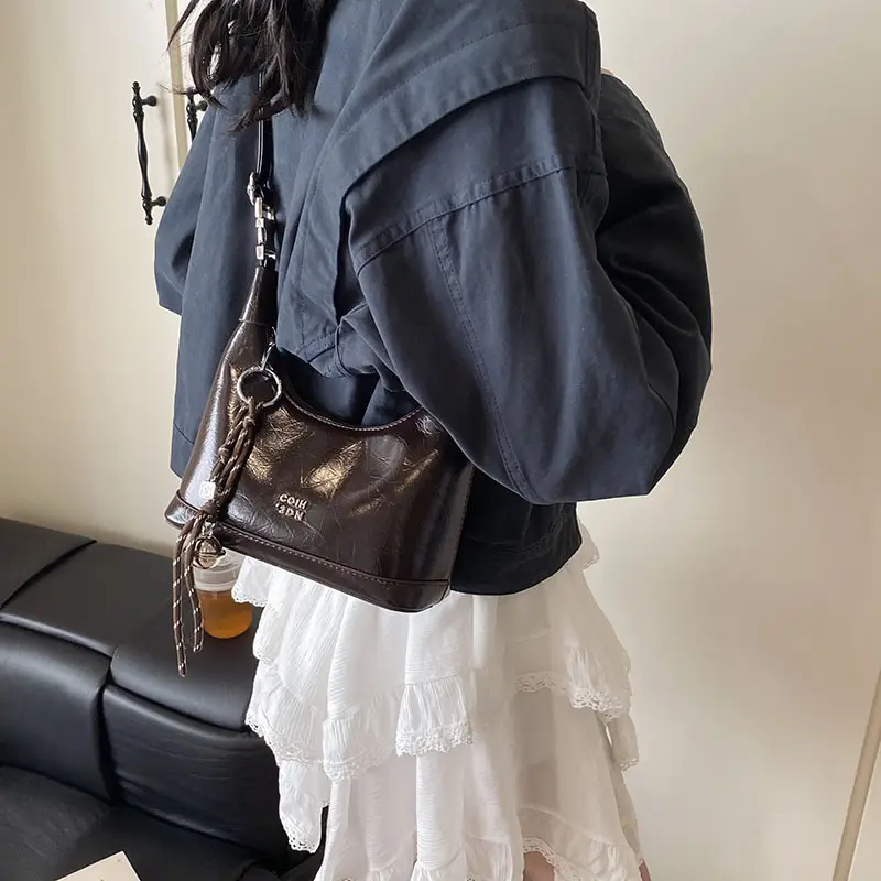 Black Leather Pea Bag with Gold Handle for Women - Image 5