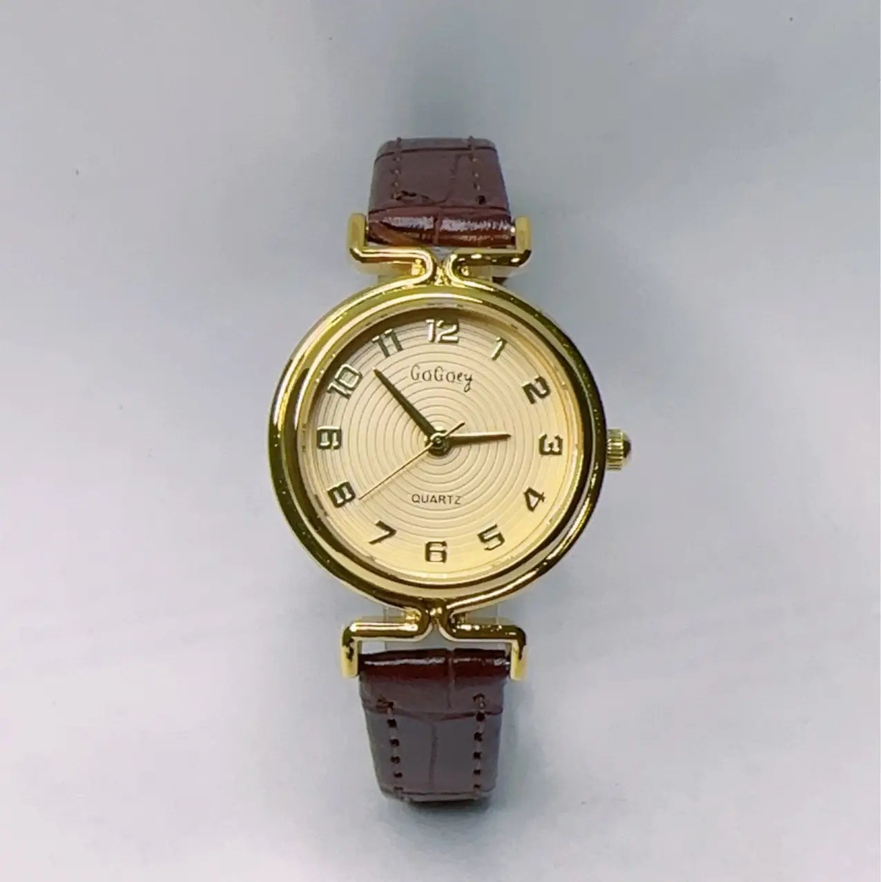 Women's Gold Dial Quartz Watch with Black Leather Strap — feature 5