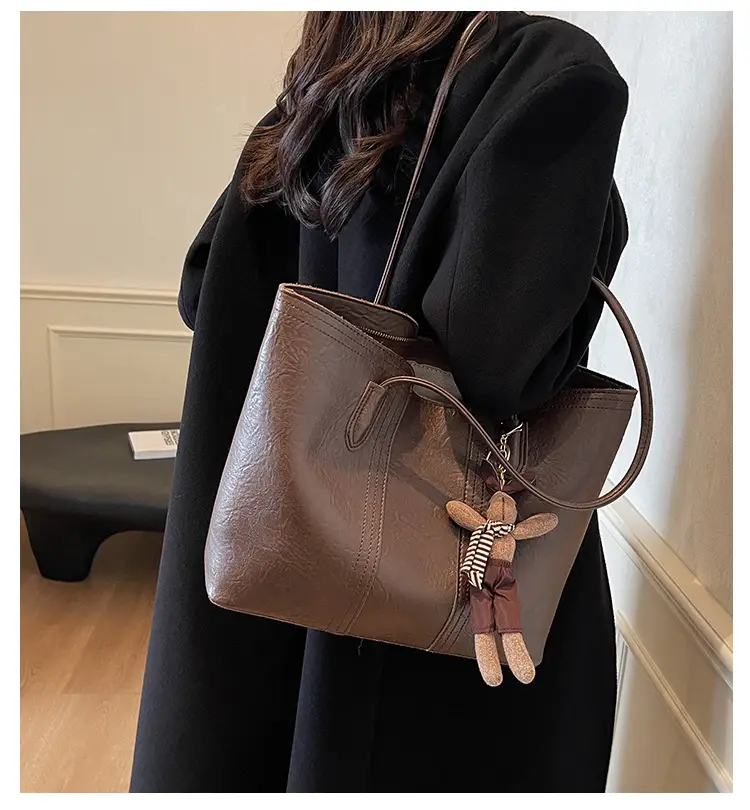 Women's Black Leather Shoulder Bag with Wooden Charm — feature 1