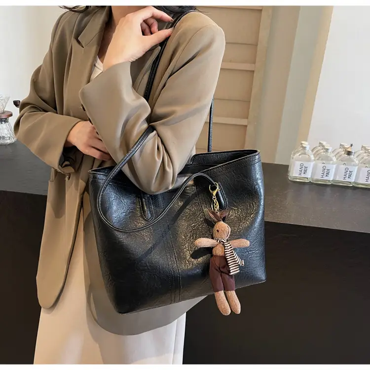 Women's Black Leather Shoulder Bag with Wooden Charm — feature 13