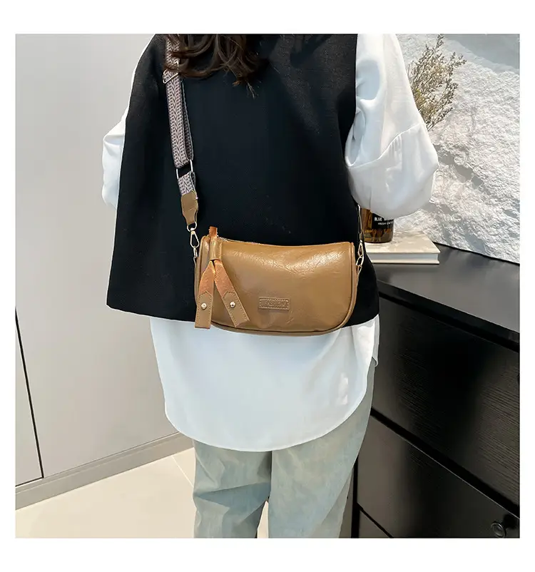 Black French Style Crossbody Bag with Textured Strap — feature 10