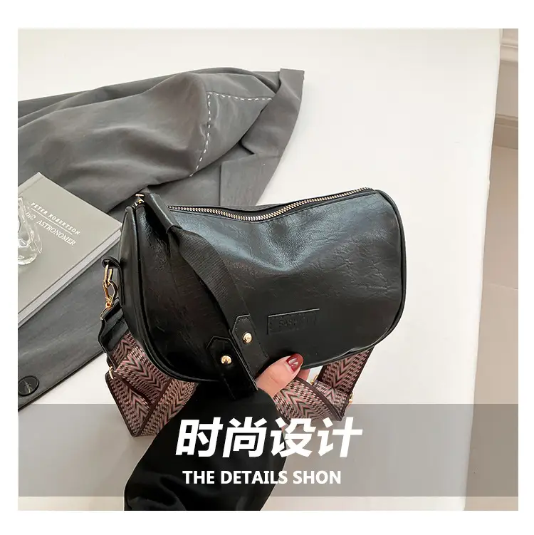 Black French Style Crossbody Bag with Textured Strap — feature 2
