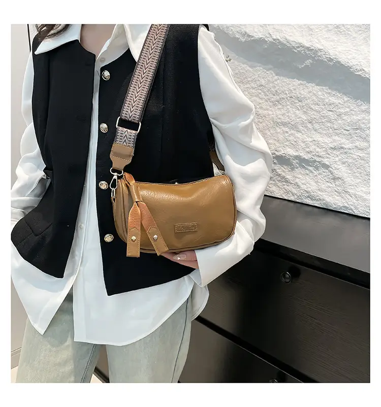 Black French Style Crossbody Bag with Textured Strap — feature 7