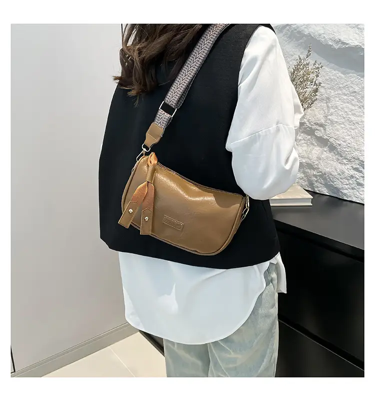 Black French Style Crossbody Bag with Textured Strap — feature 8