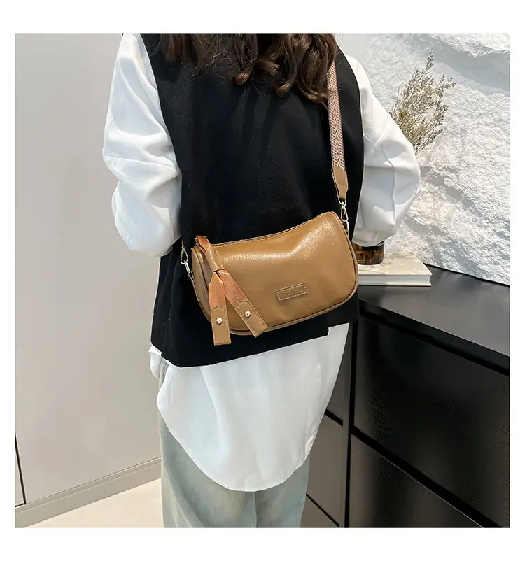 Black French Style Crossbody Bag with Textured Strap — feature 9