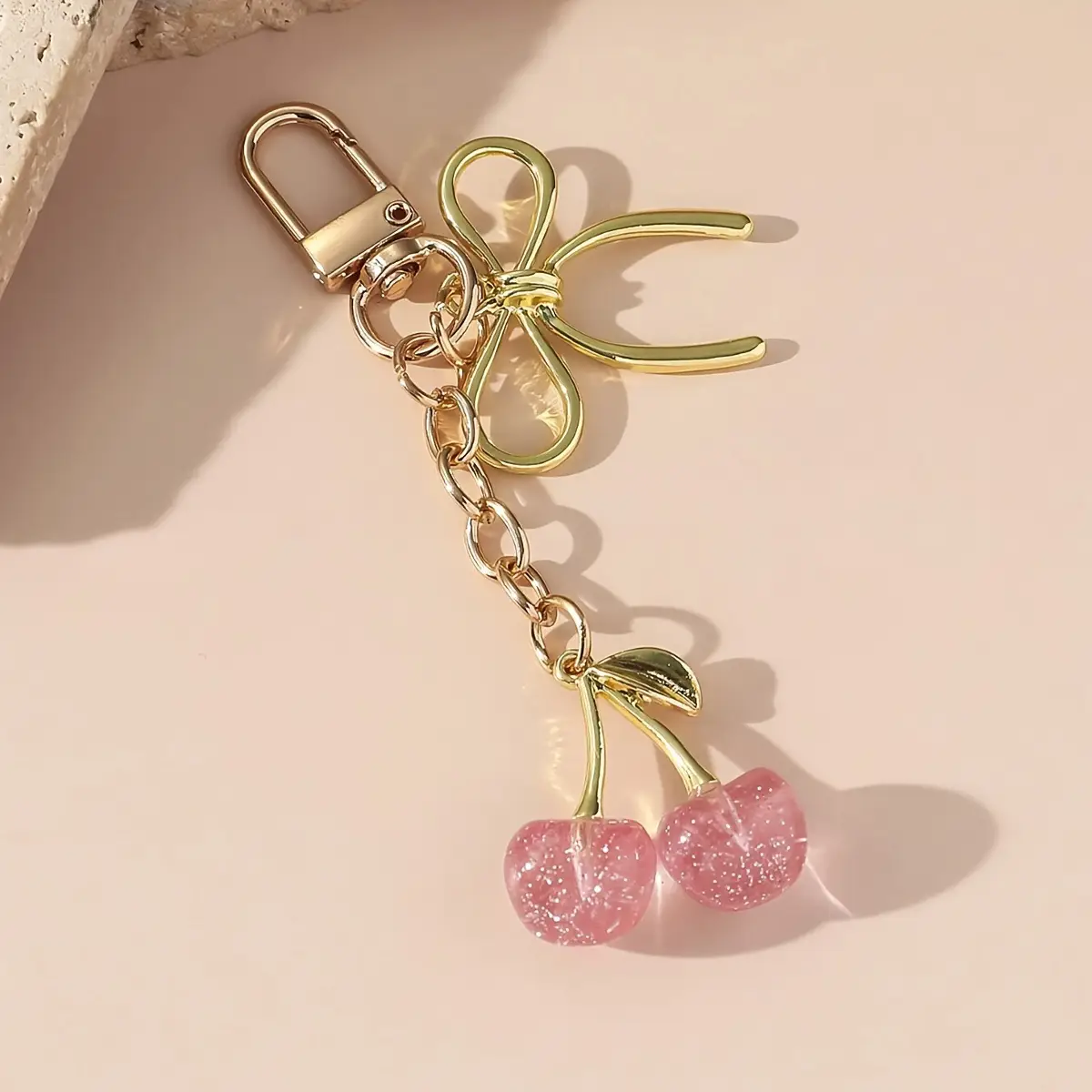 Golden Crystal Keychain with Bow Pendant Design — feature 7