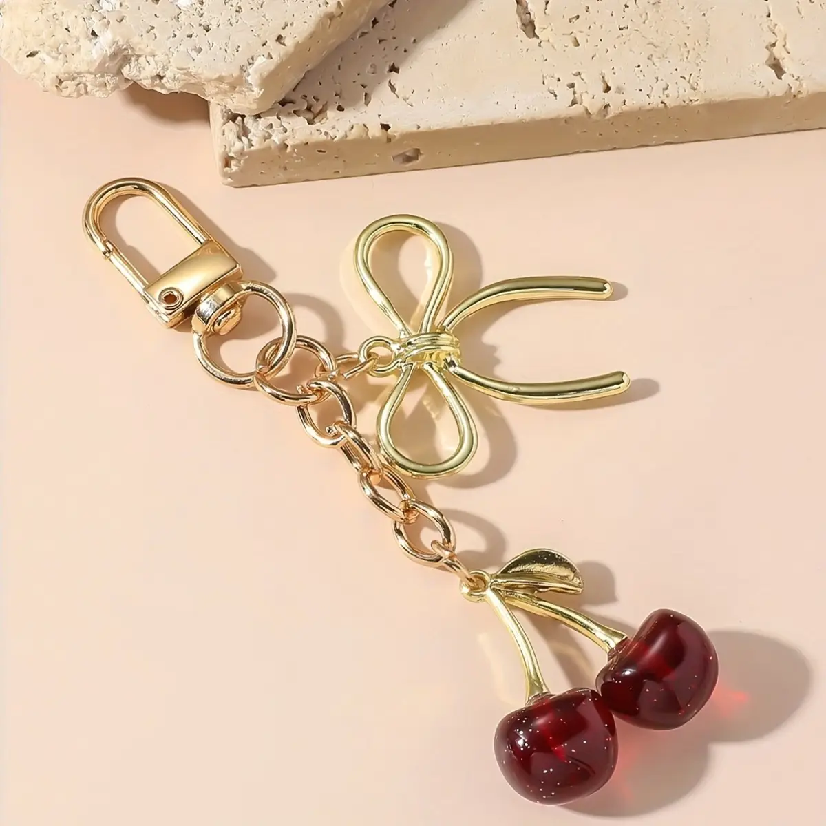Golden Crystal Keychain with Bow Pendant Design - Image 2