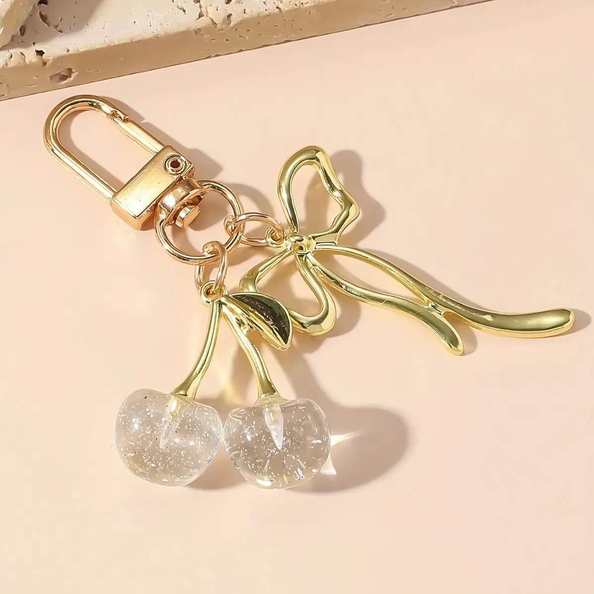 Golden Crystal Keychain with Bow Pendant Design - Image 3