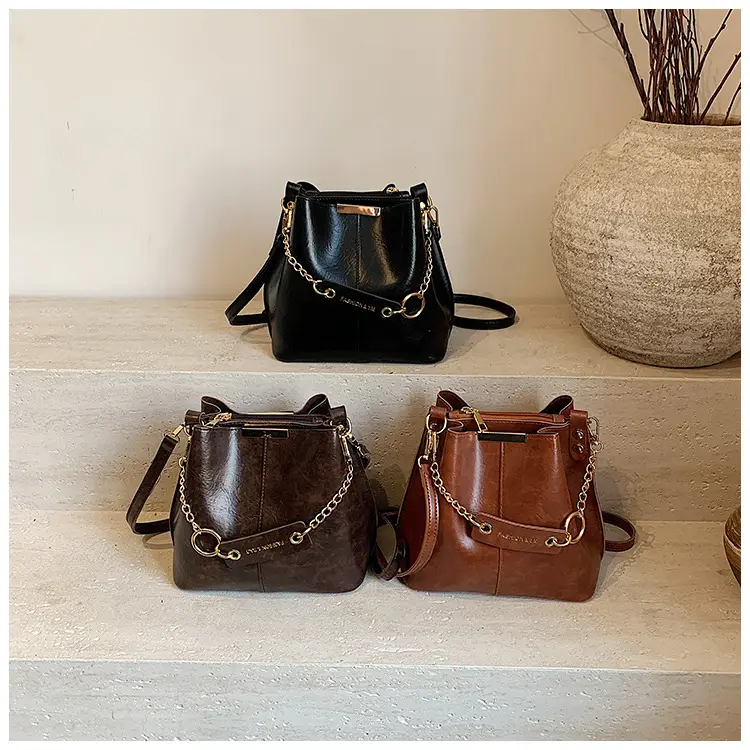 Women's Brown Leather Bucket Bag with Chain Strap — feature 1