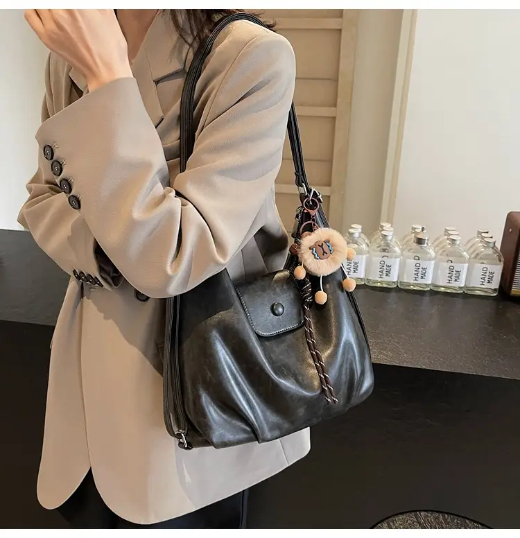 Women's Brown Leather Tote Bag with Pom Pom Charm — feature 36