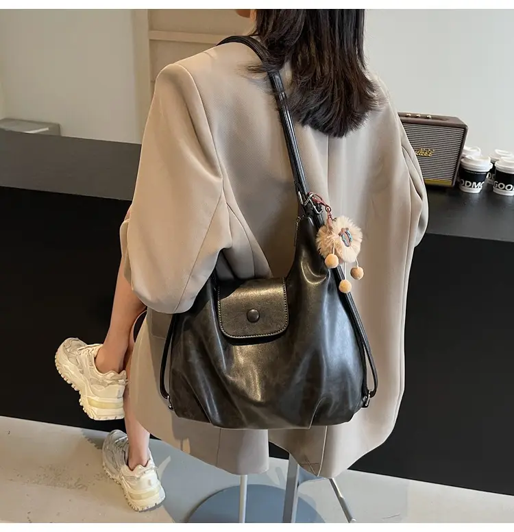 Women's Brown Leather Tote Bag with Pom Pom Charm — feature 43