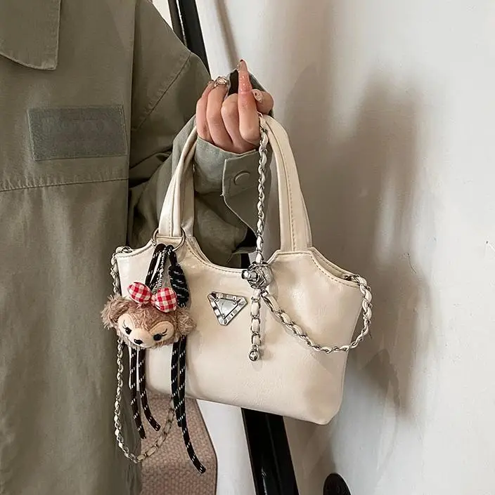 Women's Silver Chain Shoulder Bag with Cute Doll Design - Image 6