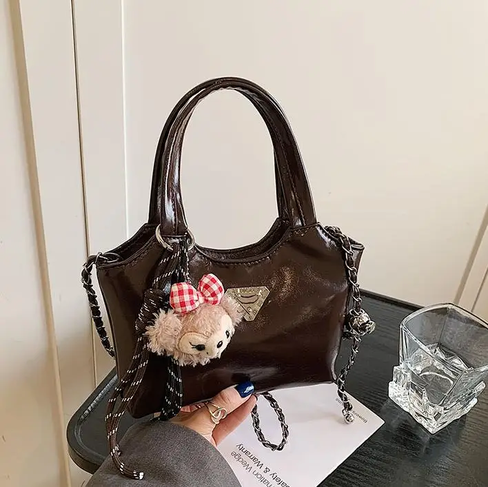 Women's Silver Chain Shoulder Bag with Cute Doll Design - Image 8