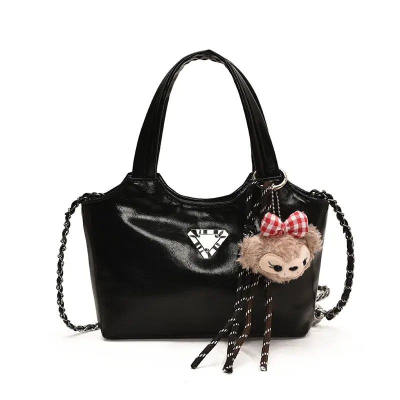 Women's Silver Chain Shoulder Bag with Cute Doll Design - Image 9