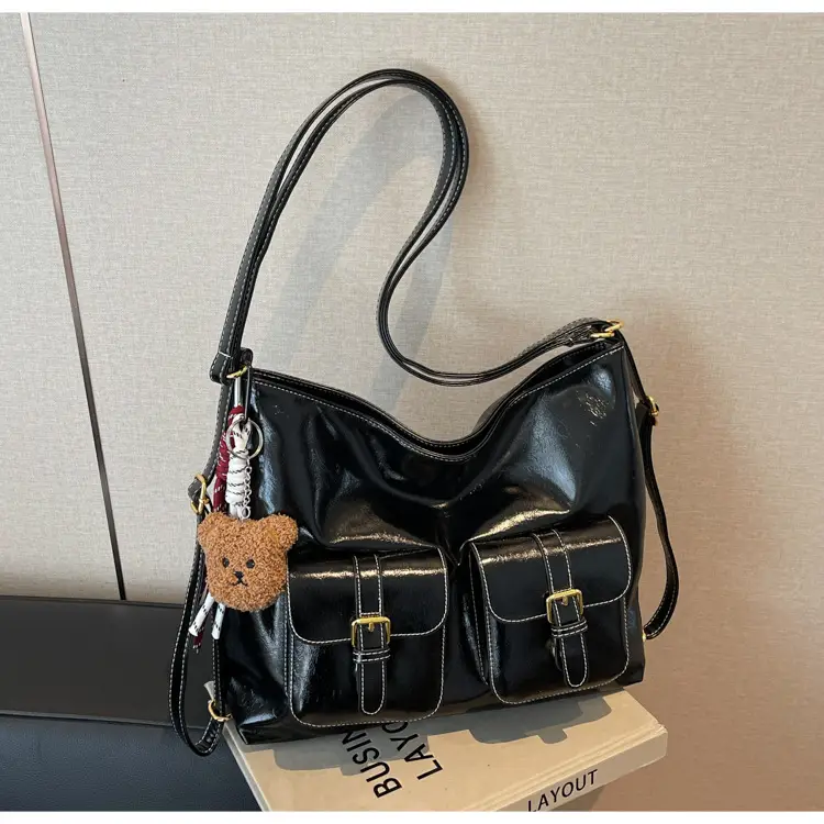 Black Leather Crossbody Bag with Gold Clasp & Teddy Keychain — feature 10