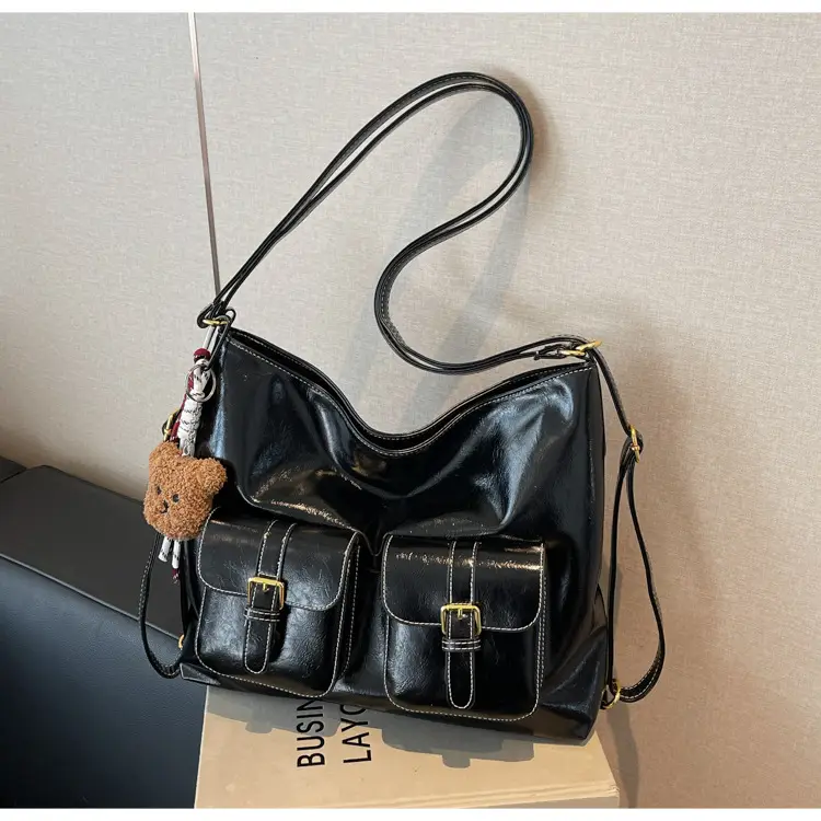 Black Leather Crossbody Bag with Gold Clasp & Teddy Keychain — feature 11