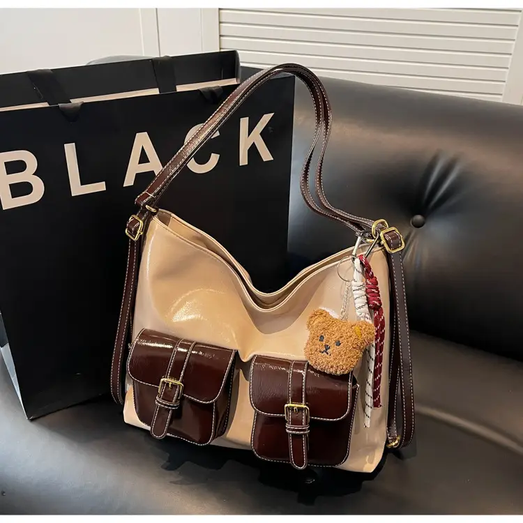 Black Leather Crossbody Bag with Gold Clasp & Teddy Keychain — feature 15
