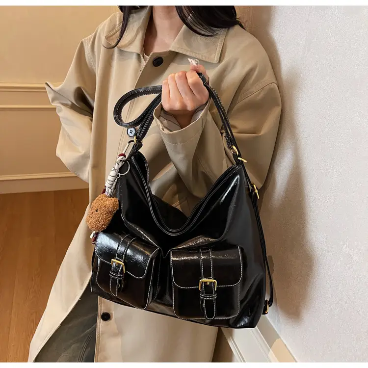 Black Leather Crossbody Bag with Gold Clasp & Teddy Keychain — feature 18
