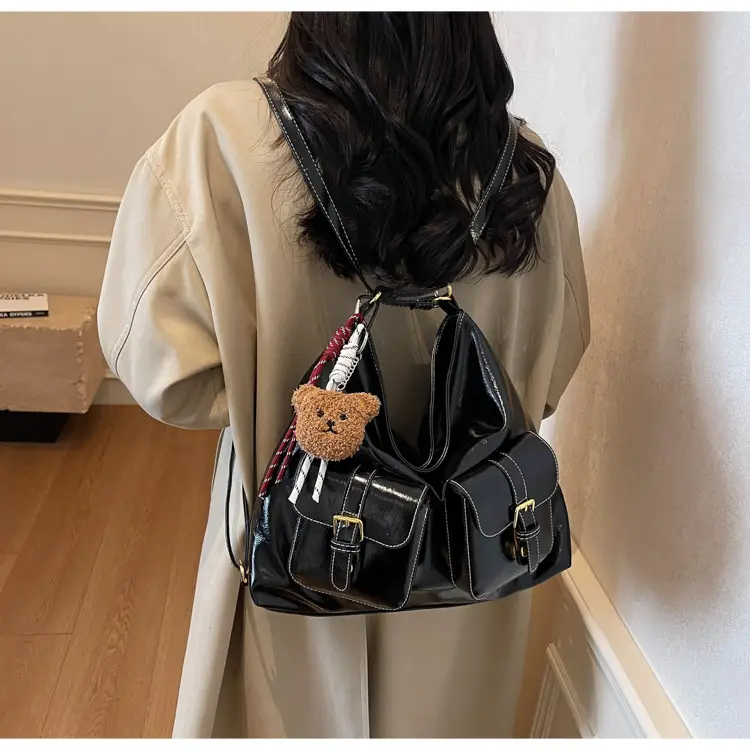 Black Leather Crossbody Bag with Gold Clasp & Teddy Keychain — feature 19