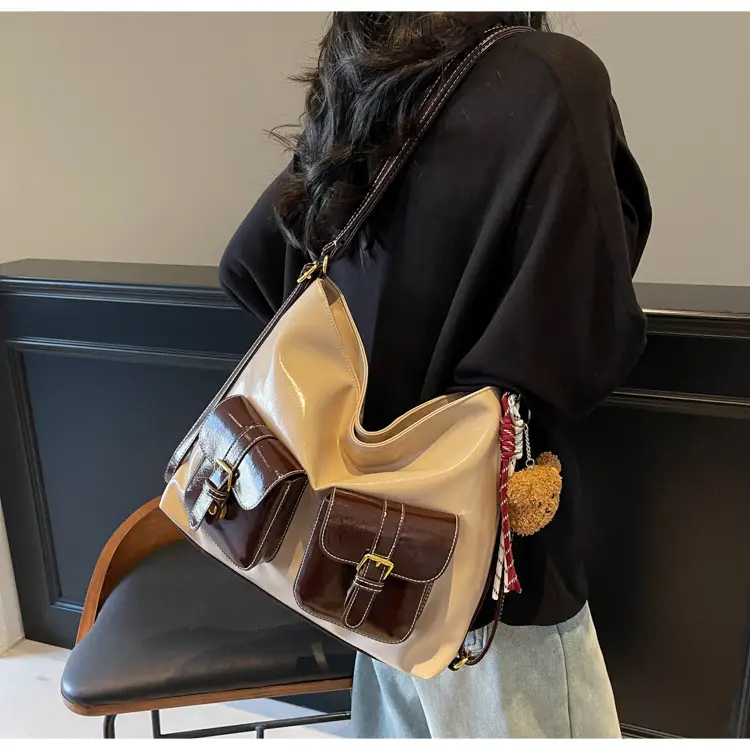 Black Leather Crossbody Bag with Gold Clasp & Teddy Keychain — feature 21